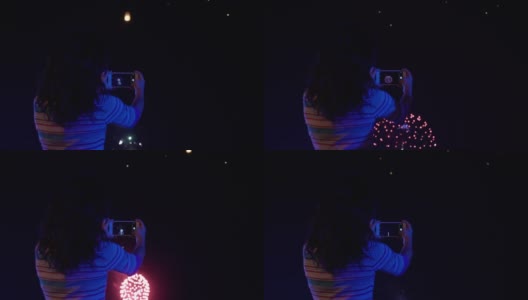 一名亚洲妇女看着天灯飞向夜空高清在线视频素材下载