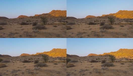 彩色的日出在纳米比亚沙漠，澳大利亚，纳米比亚，非洲。晴朗的天空，发光的岩石和山丘，时间流逝视频。高清在线视频素材下载