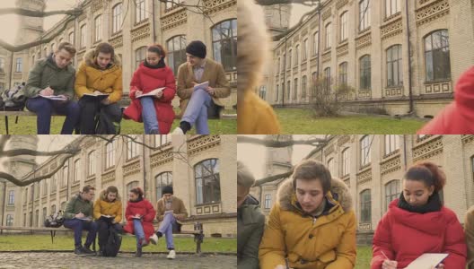学生们坐在大学附近公园的长椅上谈话高清在线视频素材下载