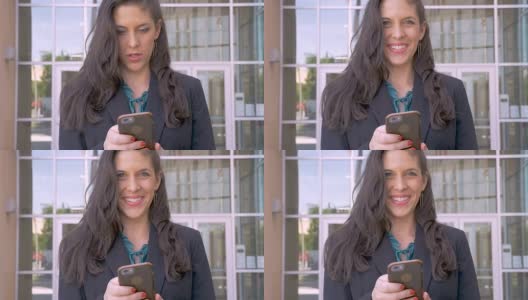 一位女性公司主管从她的移动设备上抬起头，微笑着高清在线视频素材下载