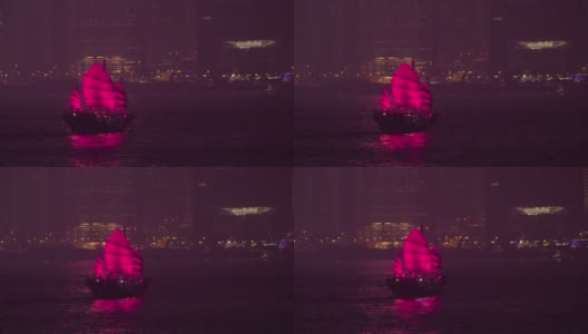 黄昏时分，维多利亚港的一艘红色帆船高清在线视频素材下载