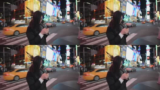 女性在时代广场使用智能手机高清在线视频素材下载