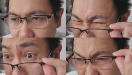 一个戴眼镜的男人的近距离检查他的视力，模糊的视力问题高清在线视频素材下载