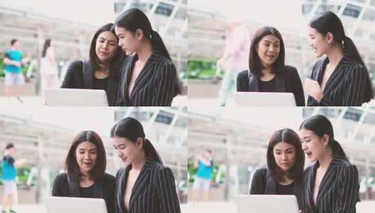 商界女性通过在线笔记本电脑与合作伙伴讨论大项目高清在线视频素材下载