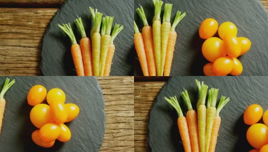 西红柿和胡萝卜摆放在4k木桌上高清在线视频素材下载