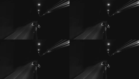 一辆汽车高速通过隧道的4K黑白视频高清在线视频素材下载