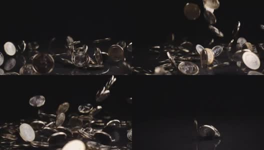 一枚欧元硬币落在黑色背景上高清在线视频素材下载