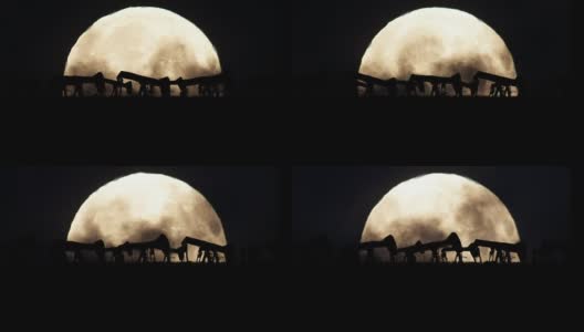 油泵剪影在满月的背景在一个污染的环境高清在线视频素材下载