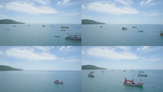 航拍:夏天，渔船队在风景如画的海面上平静地休息。高清在线视频素材下载