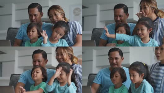 Happy family using laptop together高清在线视频素材下载