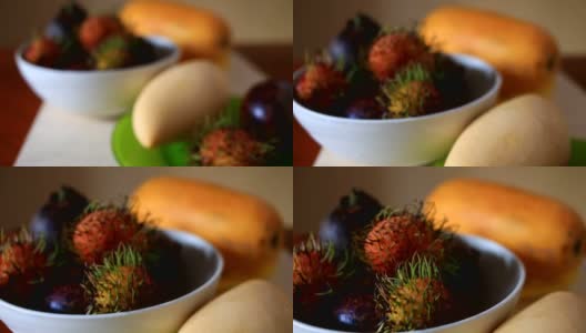 餐桌上有异国情调的热带水果。泰国的水果高清在线视频素材下载