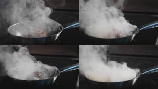 煎鱼，马林鱼片放在蒸熟的煎锅上慢动作。高清在线视频素材下载