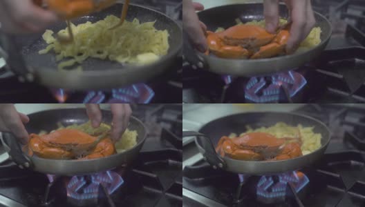 在厨房炉灶上的煎锅里准备意大利面和红海蟹。在餐厅厨房用海鲜制作意大利面食。用新鲜海鲜烹制意大利面高清在线视频素材下载