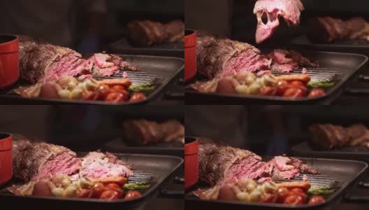 4K超高清手持:近距离厨师准备雕刻的上等肋牛肉在自助餐厅服务。高清在线视频素材下载