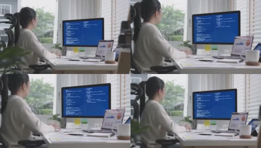 侧面的年轻亚洲女性，自由数据科学家在家远程编码编程大数据挖掘，人工智能数据工程，IT技术员工作在人工智能项目。高清在线视频素材下载