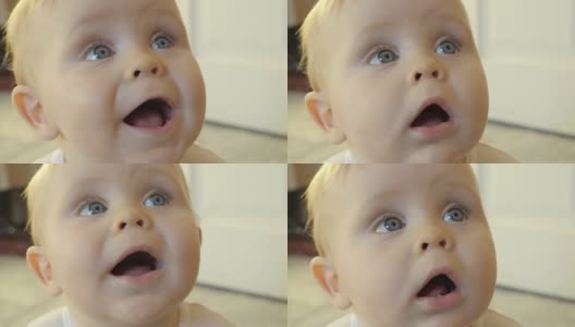 一个可爱的蓝眼睛孩子的惊讶表情。高清在线视频素材下载