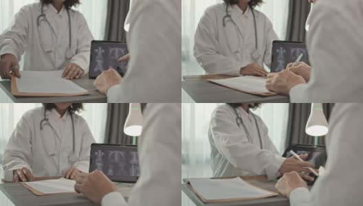 女医生在他的办公室给病人看病高清在线视频素材下载
