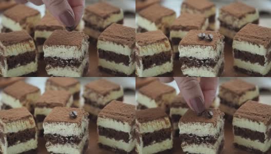 糕点师用提拉米苏咖啡豆装饰蛋糕高清在线视频素材下载