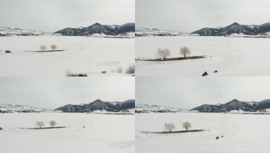 蒙大拿湖上的雪地摩托高清在线视频素材下载