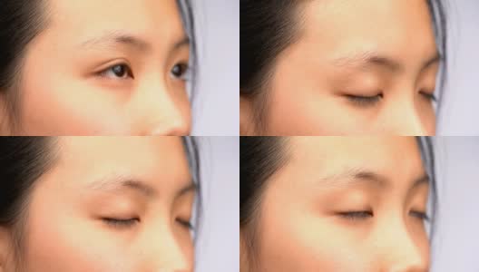 4K CU微距拍摄亚洲女人的眼睛睁开和闭上高清在线视频素材下载