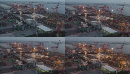 白天到夜晚延时:鸟瞰图的港口工作的货物集装箱在台场日本东京高清在线视频素材下载
