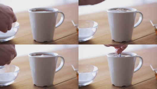手加糖到茶或咖啡中高清在线视频素材下载