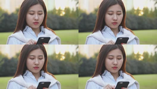 4k:美丽的亚洲女孩在公园，中国上海高清在线视频素材下载