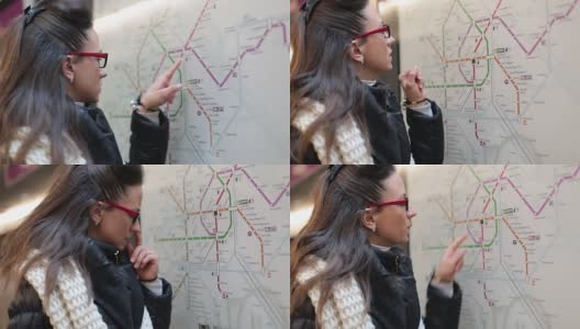 一位年轻女士正在查看旅游城市地图高清在线视频素材下载