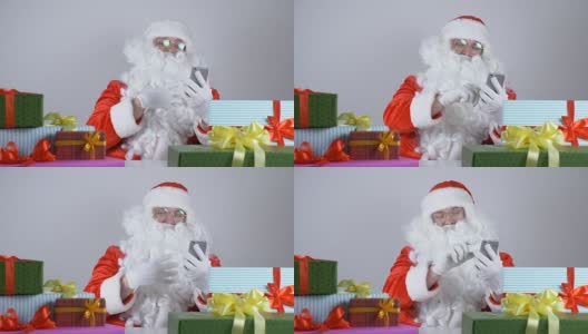 圣诞老人用手机，笑起来是50fps高清在线视频素材下载