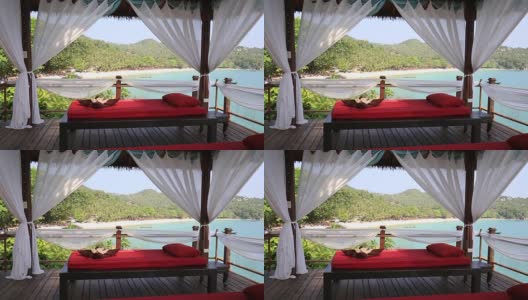 俯瞰大海的按摩桌。泰国海滩上的水疗按摩室高清在线视频素材下载