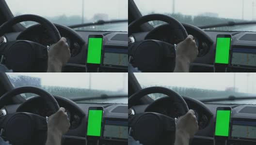 在驾驶室用绿色屏幕拍摄的手机。伟大的模型使用。高清在线视频素材下载