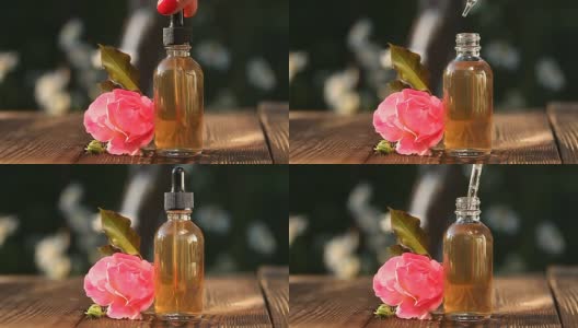 玫瑰精华放在漂亮的玻璃瓶桌上高清在线视频素材下载