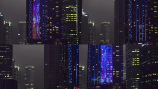 闪亮的反光科幻摩天大楼在亚洲大都市的市中心淘金。高清在线视频素材下载