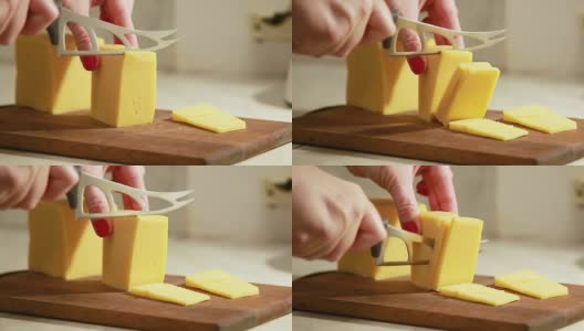 女人用手切硬荷兰奶酪高清在线视频素材下载