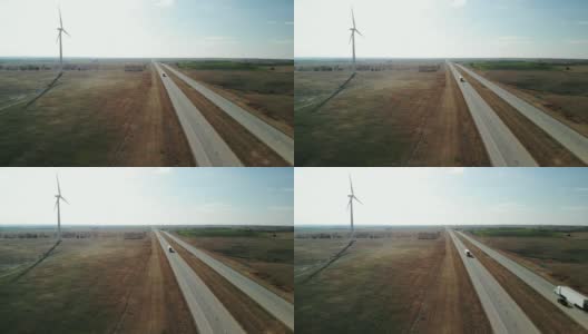 鸟瞰图早春风力涡轮机和中西部州际交通4K视频高清在线视频素材下载
