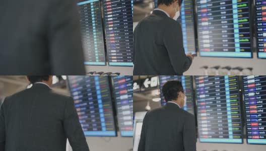 商人在机场查询航班信息。高清在线视频素材下载