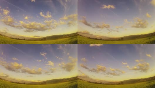 绿麦，稻田和多云的天空时光流逝，广角高清在线视频素材下载