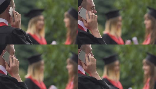 微笑的男毕业生打电话，心不在焉的女学生社交高清在线视频素材下载