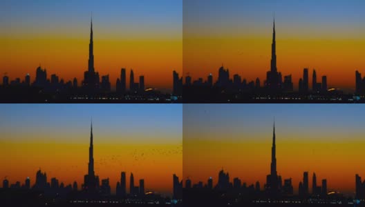 夕阳下迪拜的高楼大厦。模糊或失焦样式高清在线视频素材下载