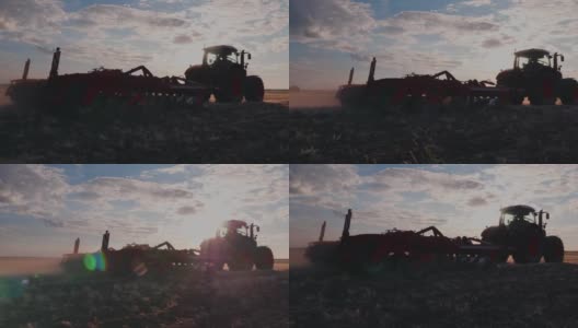稳定器镜头:拖拉机在日落时耙地高清在线视频素材下载