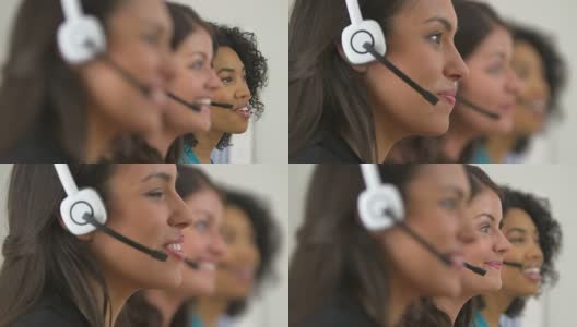 机架焦点之间的三个客户服务代表谈论耳机高清在线视频素材下载