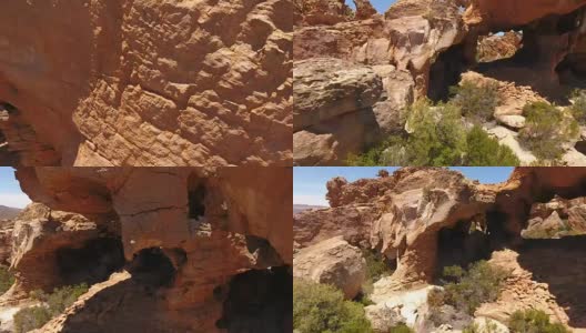 飞过南非有洞穴的岩石高清在线视频素材下载