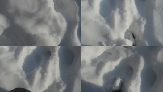 俯视着走过厚厚的雪地的双脚高清在线视频素材下载