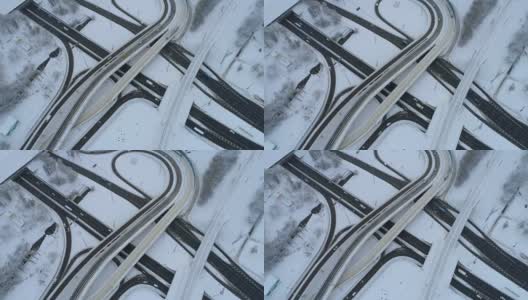 鸟瞰图高速公路交叉口在冬天被雪覆盖。高清在线视频素材下载