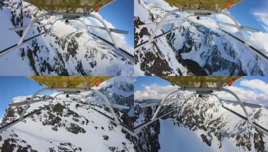 在美国西北部太平洋地区的雪山之间高速飞行的直升机下的POV山激烈的动作快速转弯特写高清在线视频素材下载