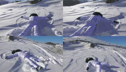 年轻女子摔倒了，做了个雪天使。超高清4K摄像机库存镜头高清在线视频素材下载