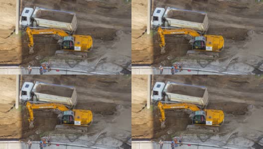 工业装载机挖土机移动地面和装填到自卸车的时间间隔高清在线视频素材下载