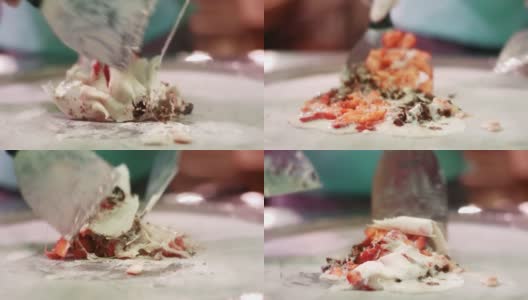 厨师混合原料制作冰淇淋卷。混合牛奶和水果高清在线视频素材下载