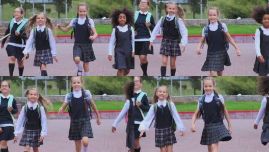 身着制服的可爱女孩们迎着鲜花在校园里奔跑高清在线视频素材下载