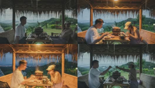 年轻的夫妇在小屋里烤着泰式猪肉烧烤，旁边是山上的薄雾高清在线视频素材下载